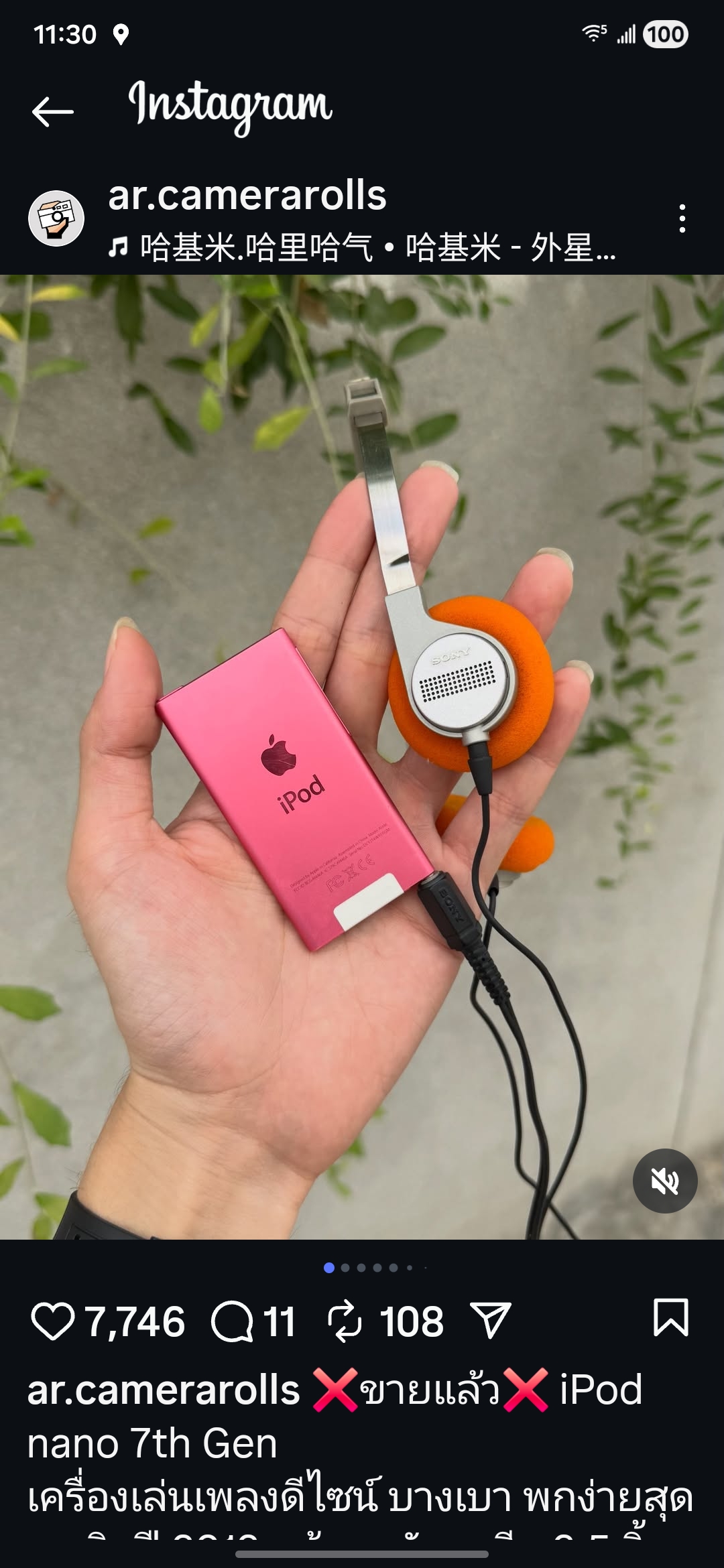 Instagram post showing pink iPod nano with headphones in hand.