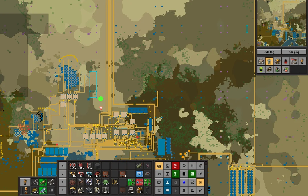 Factorio game map showing factory layout with conveyor belts and production buildings.